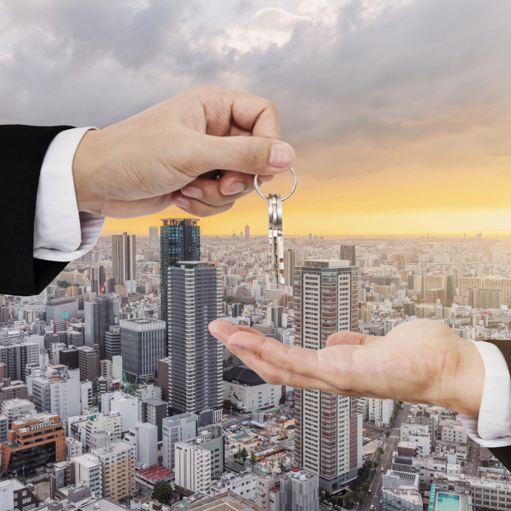 two hands above buildings